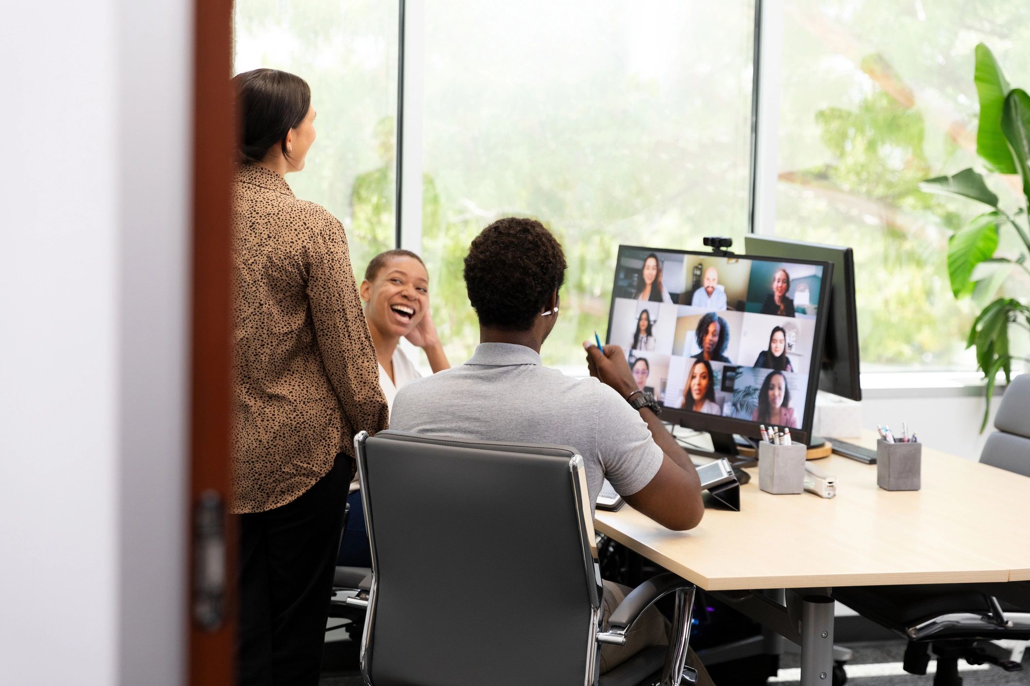 Employees collaborating in a hybrid virtual meeting
