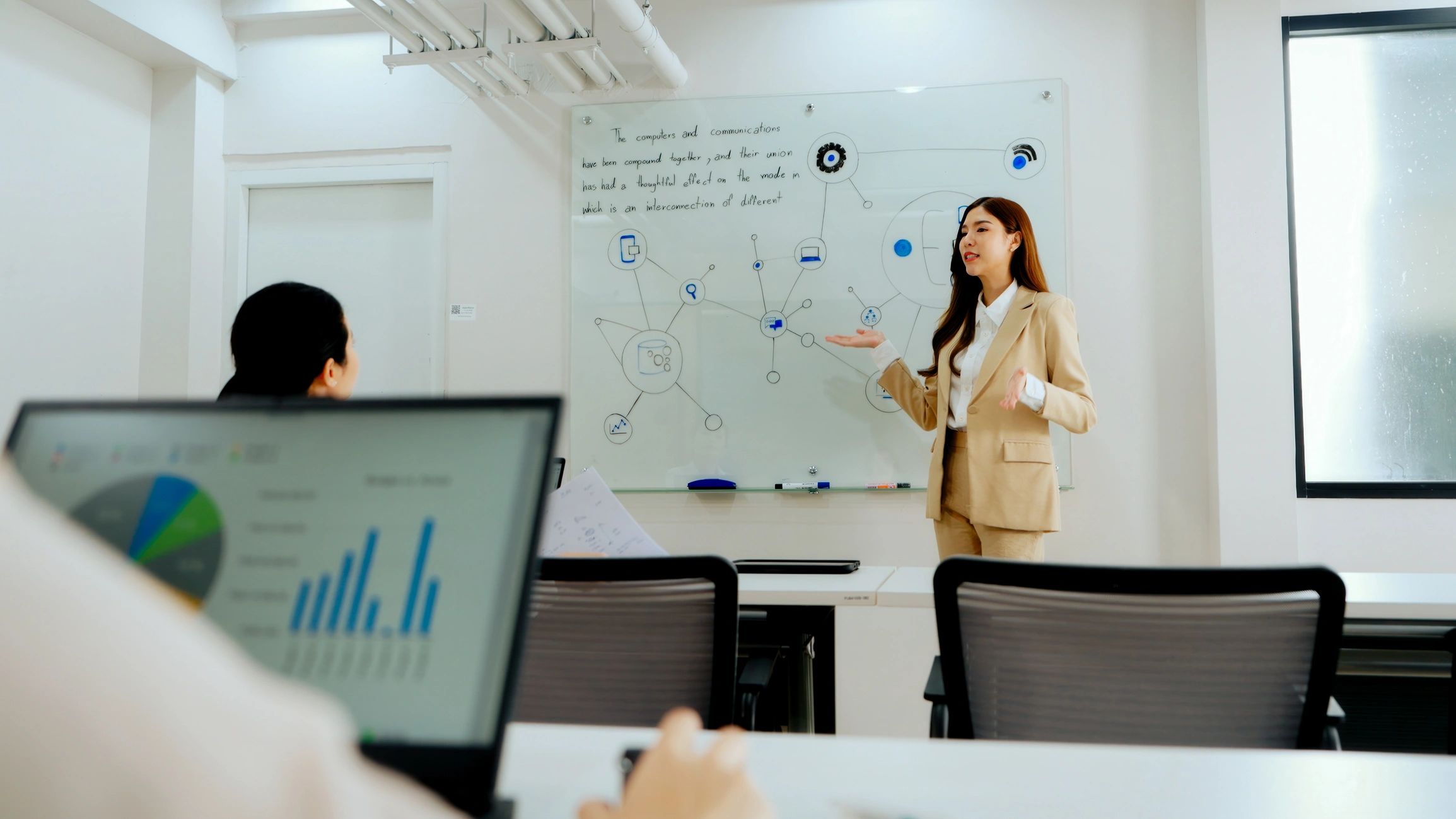 Businesswoman leading a technology training presentation